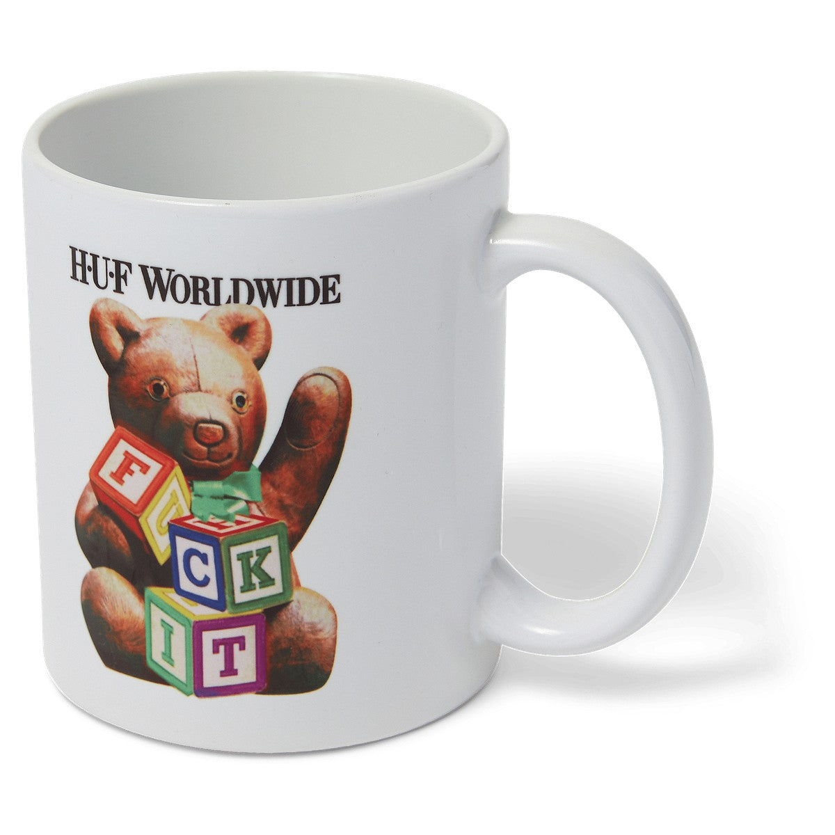 HUF Gift Bear white ceramic mug with teddy bear and colourful block artwork, angle view